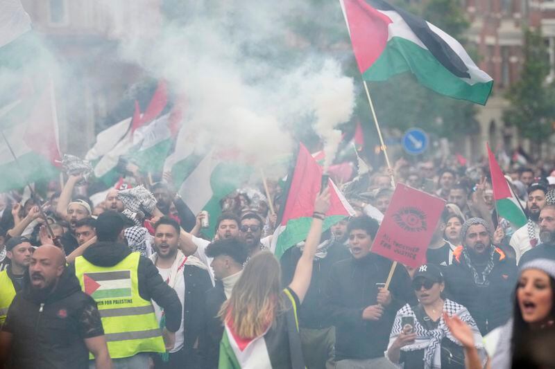 People wave Palestinian flags during a Pro-Palestinian demonstration for excluding Israel from Eurovision ahead of the second semi-final at the Eurovision Song Contest in Malmo, Sweden, Thursday, May 9, 2024. (AP Photo/Martin Meissner)