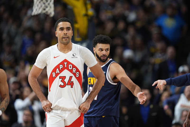 FILE - Toronto Raptors center Jontay Porter (34) and Denver Nuggets guard Jamal Murray (27) are shown in the second half of an NBA basketball game Monday, March 11, 2024, in Denver. The NBA banned Toronto two-way player Jontay Porter on Wednesday, April 17, 2024, after a league probe found he disclosed confidential information to sports bettors and bet on games.(AP Photo/David Zalubowski, File)