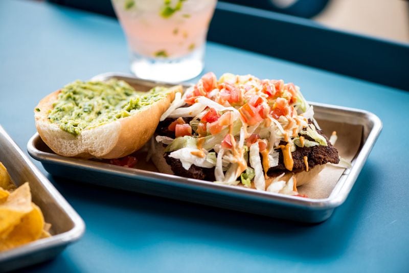 Street Taco Chicken Milanesa Torta with lettuce, tomato, beans, guac, and chipotle aioli. Photo credit- Mia Yakel.