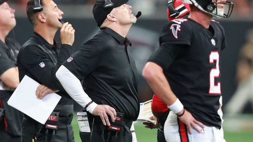 Falcons offensive coordinator Steve Sarkisian (from left), head coach Dan Quinn, and quarterback Matt Ryan can only watch from the sidelines in the fourth quarter falling to the Bengals 37-36 in a NFL football game on Sunday, Sept 30, 2018, in Atlanta.   Curtis Compton/ccompton@ajc.com