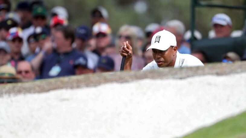 Tiger Woods lines up his putt on No. 7 during the second round of the Masters Tournament on April 6, 2018, at Augusta National Golf Club. PHOTO / JASON GETZ