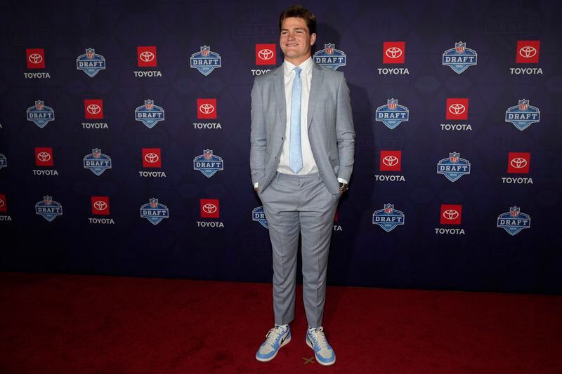 North Carolina quarterback Drake Maye poses on the red carpet ahead of the first round of the NFL football draft, Thursday, April 25, 2024, in Detroit. (AP Photo/Carlos Osorio)