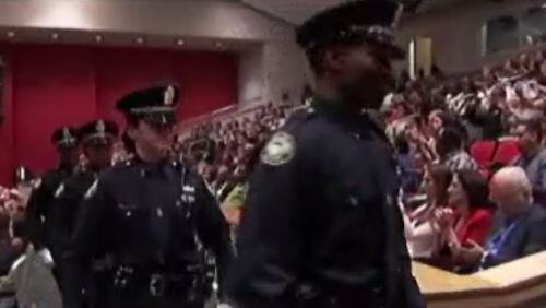 Atlanta police recruits leave a ceremony. (Credit: Channel 2 Action News)