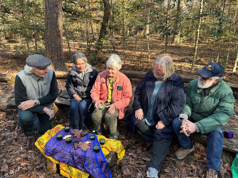 Robin Hancock (center) is a certified Forest Bathing guide. Forest bathing originated in Japan to help stressed out workers relax and appreciate nature. The session end with a tea ceremony where bathers are invited to chat and share their experiences. Image credit: Nedra Rhone