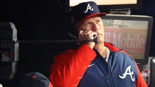 Braves manager Brian Snitker calls the bullpen before the start of the ninth inning against the Houston Astros in game 5 of the World Series at Truist Park, Sunday, October 31, 2021, in Atlanta. Curtis Compton / curtis.compton@ajc.com