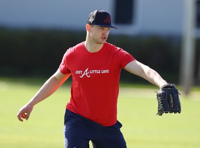 031422 North Port: Atlanta Braves injured pitcher Mike Soroka, recovering from a Achilles tendon tear, loosens up during the first day of team practice at Spring Training on Monday, March 14, 2022, in North Port.   “Curtis Compton / Curtis.Compton@ajc.com”
