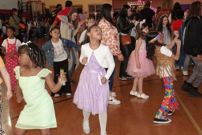 The students and their families are "all in" at Sawyer Road Elementary School's first-ever dance. (Photo Courtesy of Majid Bassery)