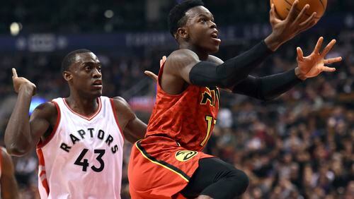 Atlanta Hawks guard Dennis Schroder (17) goes to the basket as Toronto Raptors forward Pascal Siakam (43) defends during the first half of an NBA basketball game Saturday, Dec. 3, 2016, in Toronto. (Frank Gunn/The Canadian Press via AP)
