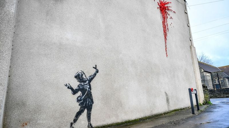 Street artist Banksy confirms Valentine’s Day mural on side of wall is his work