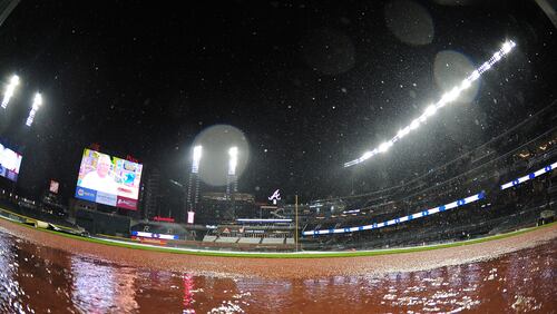 The Braves and the Texas Rangers waited out a pregame rain delay at SunTrust Park Tuesday night. The game was eventually postponed. (Photo by Scott Cunningham/Getty Images)