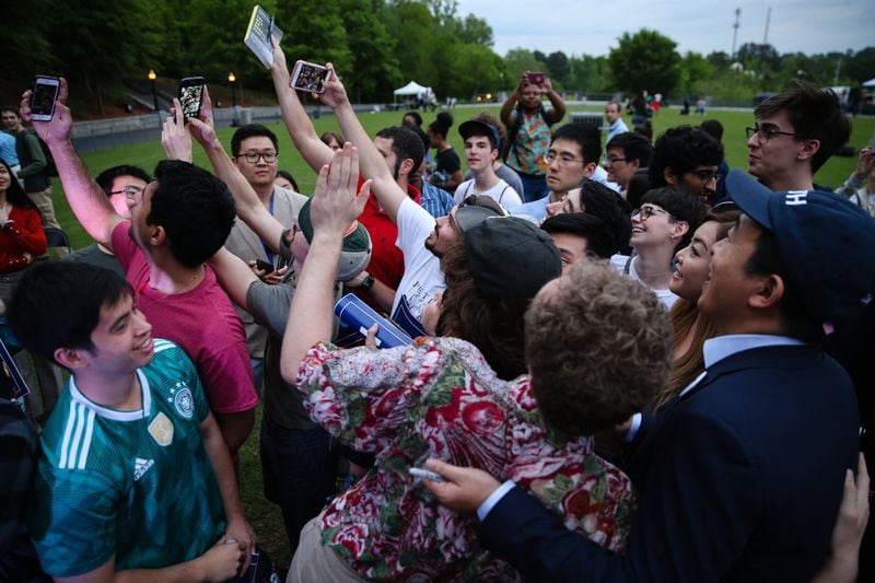 2020 Democratic presidential candidate Andrew Yang takes a photo with supporters following a campaign event in Piedmont Park. ELIJAH NOUVELAGE/SPECIAL