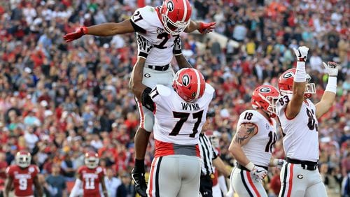 PASADENA, CA - JANUARY 01: Nick Chubb #27 of the Georgia Bulldogs and Isaiah Wynn #77 of the Georgia Bulldogs celebrate after a 50 yard touchdown in the 2018 College Football Playoff Semifinal Game against the Oklahoma Sooners at the Rose Bowl Game presented by Northwestern Mutual at the Rose Bowl on January 1, 2018 in Pasadena, California.  (Photo by Sean M. Haffey/Getty Images)