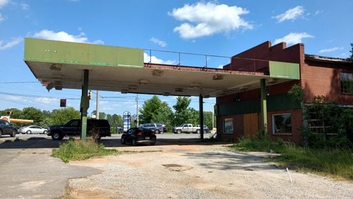 Landmark store and former gas  station in the Hickory Flat community of Cherokee County has been torn down for a fast-food restaurant. (Brian O'Shea /bposhea@ajc.com)
