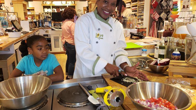 Earlier this summer, Tasha Roberts of Love Guac and her daughter Aijalon demonstrated the fine art of making guacamole at the Williams Sonoma store in Peachtree City. CONTRIBUTED BY LOVE GUAC