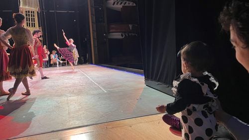 Emily Carrico performs in “Don Quixote,” while Sergio Masero and daughter Alina watch from the wings. Courtesy of Serena Chu