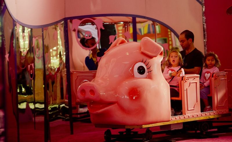 The Macy’s Pink Pig at Lenox Square mall in Buckhead (shown in November 2013) is a family favorite. Priscilla the Pink Pig carries children of all ages through a life-size storybook filled with friends and fun. JONATHAN PHILLIPS / SPECIAL