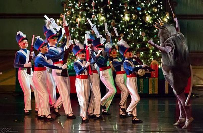 A scene from the 2014 North Atlanta Dance Theatre's "Nutcracker" displays the diverse troupe and traditional set.
