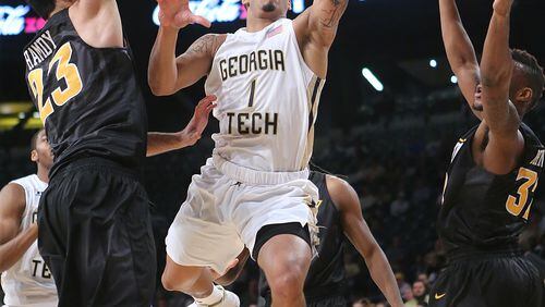 ATLANTA: Georgia Tech guard Tadric Jackson splits VCU defenders going to the basket during the first half in a basketball game on Tuesday, Dec. 15, 2015, in Atlanta. Curtis Compton / ccompton@ajc.com