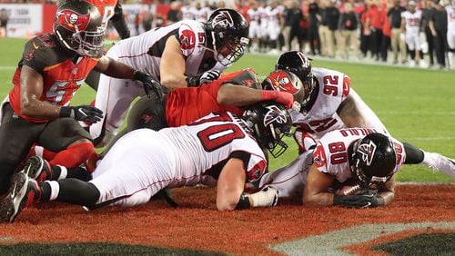 Levine Toilolo recovers Devonta Freeman’s end-zone fumble for a touchdown.
