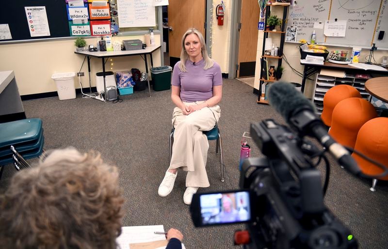 Heather Martin is interviewed in Aurora, Colo., on Thursday, April 11, 2024. Martin, a survivor of the 1999 shooting at Columbine High School in suburban Denver, hid with 60 other students in a barricaded office during the attack. It's been a quarter-century since two gunmen killed 12 fellow students and a teacher at the school, and the trauma of that day continues to shadow Martin and others who were there. (AP Photo/Thomas Peipert)