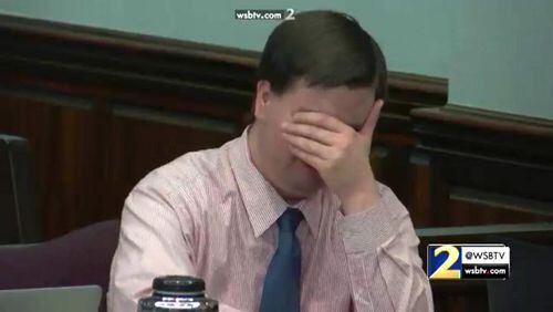 Ross Harris breaks down while his brother, Michael Baygents, testifies during the hot-car murder trial. WSB-TV