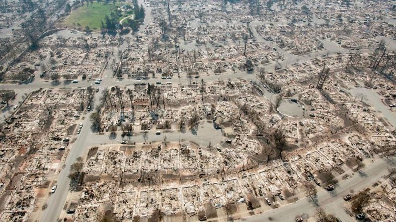 An aerial view shows burned properties in Santa Rosa, California on October 12, 2017.
Hundreds of people are still missing in massive wildfires which have swept through California killing at least 40 people and damaging thousands of homes, businesses and other buildings. 