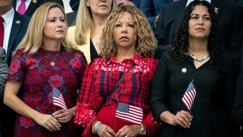 From left, Rep. Debbie Mucarsel-Powell (D-Fla.), Rep. Lucy McBath (D-Ga.) and Rep. Xochitl Torres Small (D-N.M.) join other members of the House of Representatives in observing a moment of silence at the Capitol on Wednesday, Sept. 11, 2019, to mark the 18th anniversary of the Sept. 11 terror attacks. (Erin Schaff/The New York Times)