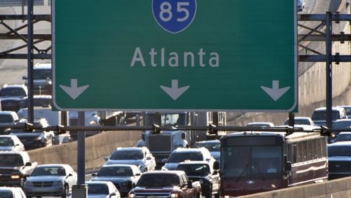 I-85 near the Spaghetti Junction is clogged with cars during rush hour on Tuesday, February 6, 2018.