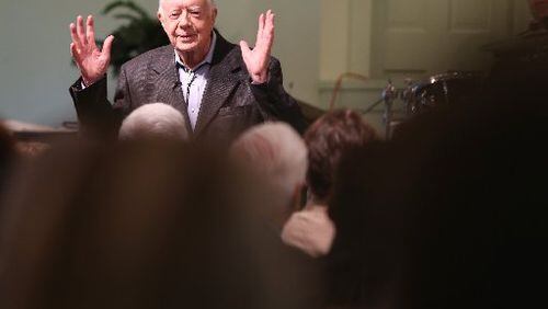 President Jimmy Carter talks to the overflow crowd at Maranatha Baptist Church in Plains on Sunday morning August 23, 2015 before teaching Sunday school. On Wednesday night, he’ll face a different audience when he answers questions from Emory University freshmen. Ben Gray / bgray@ajc.com