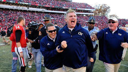 Georgia Tech head coach Paul Johnson, center, shouts and clenches his fist after Georgia quarterback Hutson Mason (14) threw an interception to Tech's D.J. White during overtime to preserve a 30-24 win in an NCAA college football game Saturday, Nov. 29, 2014, in Athens, Ga. (AP Photo/David Tulis) "How 'bout that high school offense!" (David Tulis/AP photo)