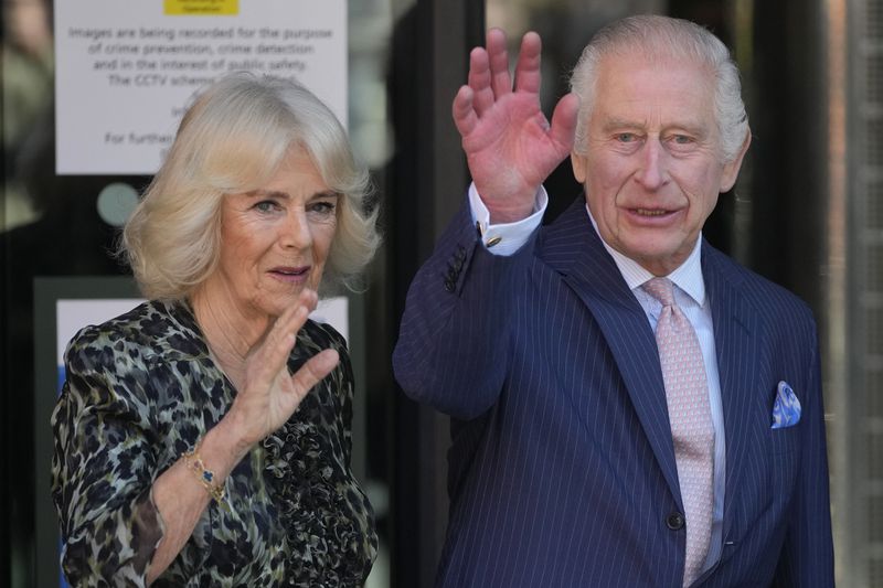 Britain's King Charles III and Queen Camilla wave as they arrive for a visit to University College Hospital Macmillan Cancer Centre in London, Tuesday, April 30, 2024. The King, Patron of Cancer Research UK and Macmillan Cancer Support, and Queen Camilla visited the University College Hospital Macmillan Cancer Centre, meeting patients and staff. This visit is to raise awareness of the importance of early diagnosis and will highlight some of the innovative research, supported by Cancer Research UK, which is taking place at the hospital. (AP Photo/Kin Cheung)