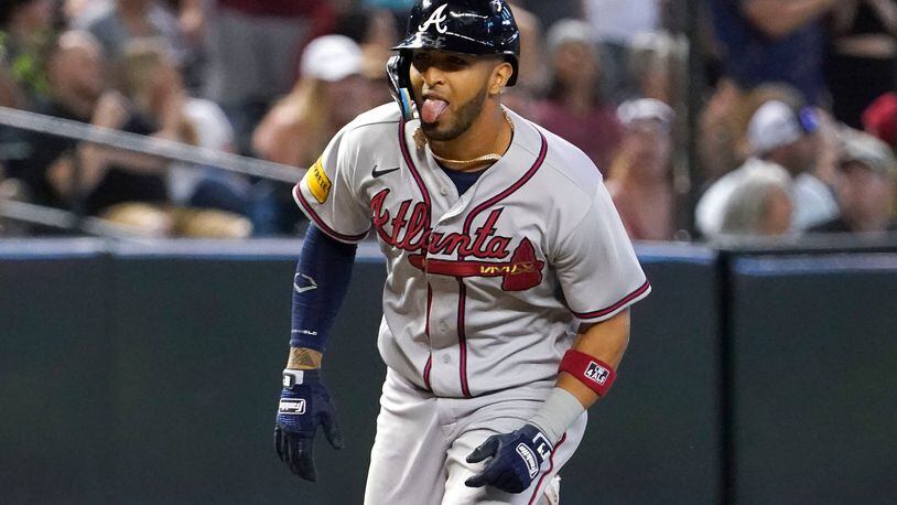 Atlanta Braves' Eddie Rosario sticks his tongue as he heads for home plate after his grand slam against the Arizona Diamondbacks during the ninth inning of a baseball game Sunday, June 4, 2023, in Phoenix. (AP Photo/Darryl Webb)