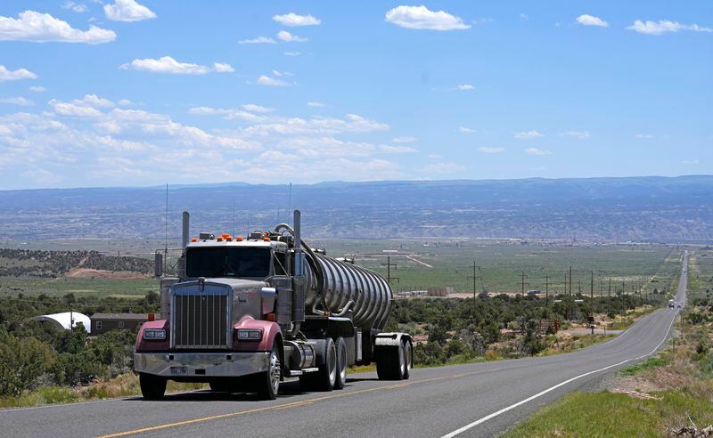 FILE - A tanker truck transports crude oil on a highway near Duchesne, Utah on July 13, 2023. The EPA on Friday, March 29, 2024, set new greenhouse gas emissions standards for heavy-duty trucks, buses and other large vehicles, an action that officials said will clean up some of the nation's largest sources of planet-warming pollution. (AP Photo/Rick Bowmer, File)