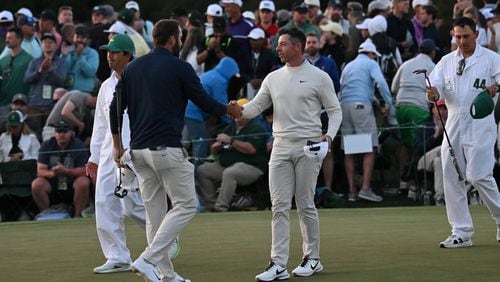Scottie Scheffler shakes hands with Rory McIlroy at the end of their second round of the 2024 Masters Tournament at Augusta National Golf Club, Friday, April 12, 2024, in Augusta, Ga. (Hyosub Shin / Hyosub.Shin@ajc.com)
