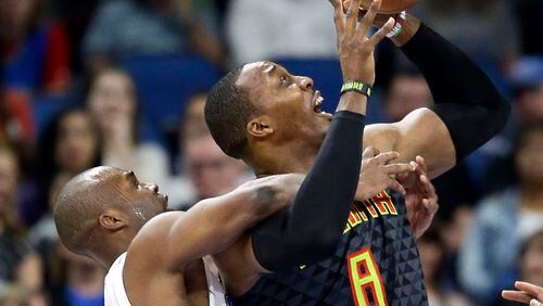 Atlanta Hawks’ Dwight Howard, right, is fouled by Orlando Magic’s Jodie Meeks, left, as he attempts a shot during the first half of an NBA basketball game, Wednesday, Jan. 4, 2017, in Orlando, Fla. (AP Photo/John Raoux)