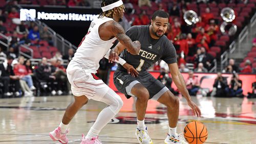Georgia Tech guard Kyle Sturdivant (1) tries to get past Louisville guard El Ellis (3) during the first half in Louisville, Ky., Wednesday, Feb. 1, 2023. (AP Photo/Timothy D. Easley)