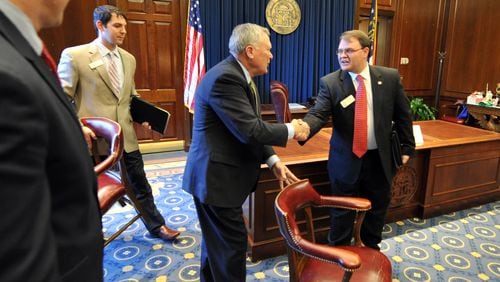 Gov. Nathan Deal greets state Rep. Jason Spencer, R-Woodbine, before meeting with local officials in Spencer’s district in Camden County in 2011. Brant Sanderlin / bsanderlin@ajc.com