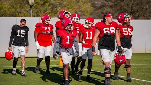 Trevor Etienne (1), Tate Ratledge (69) and another players during Georgia’s practice session in Athens, Ga., on Tuesday, March 19, 2024. (Tony Walsh/UGAAA)