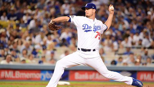 Grant Dayton of the Dodgers pitches in the fifth inning against the  Cubs in Game 5 of the National League Division Series at Dodger Stadium on October 20, 2016 in Los Angeles. Dayton joined the Braves in November 2017. (Photo by Harry How/Getty Images)