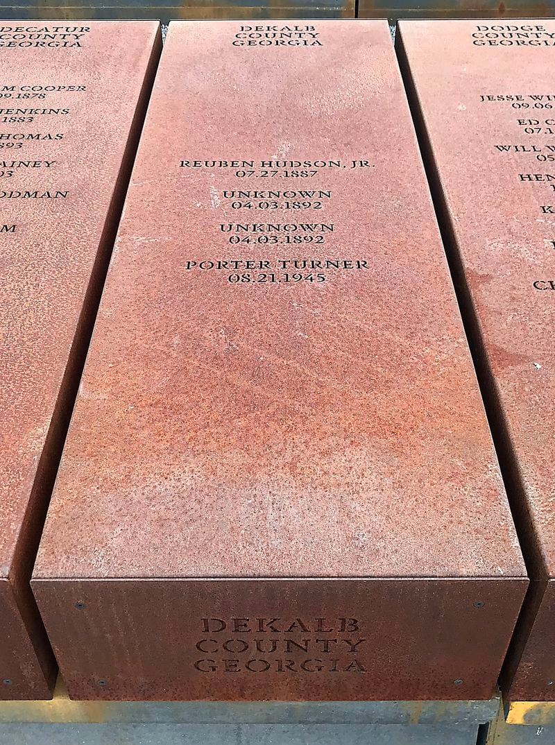  A stone marker at The National Memorial for Peace and Justice in Montgomery, Alabama recognizes several recorded lynchings that took place in DeKalb County.  TIA MITCHELL / TIA.MITCHELL@AJC.COM