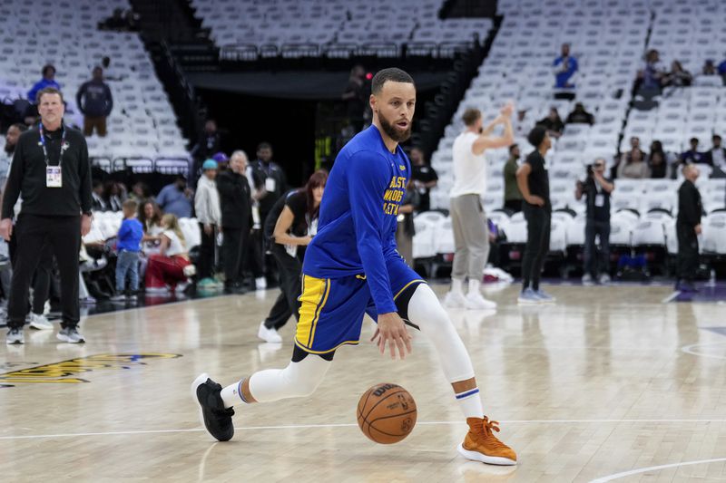 Golden State Warriors guard Stephen Curry warms up for the team's NBA basketball play-in tournament game against the Sacramento Kings, Tuesday, April 16, 2024, in Sacramento, Calif. (AP Photo/Godofredo A. Vásquez)
