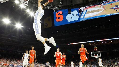 North Carolina forward Justin Jackson (44) dunks the ball on Syracuse during the second half of the NCAA Final Four tournament college basketball semifinal game Saturday, April 2, 2016, in Houston. (AP Photo/David J. Phillip)