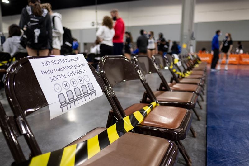 Coronavirus precautions at the Lil’ Big South volleyball tournament at the Georgia World Congress Center last month included blocked seats at courtside. (Ben Gray for The Atlanta Journal-Constitution)