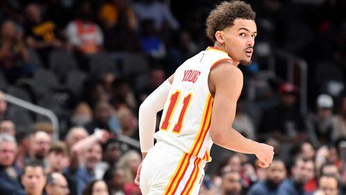 March 31, 2022 Atlanta - Atlanta Hawks' guard Trae Young (11) reacts after scoring during the first half in an NBA basketball game at State Farm Arena on Thursday, March 31, 2022. Atlanta Hawks won 131-107 over Cleveland Cavaliers. (Hyosub Shin / Hyosub.Shin@ajc.com)