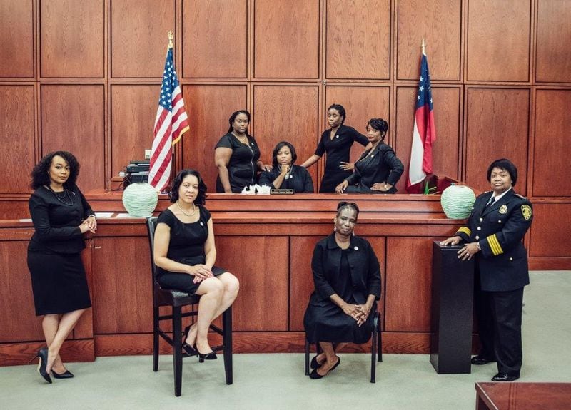 This photo went viral showing the eight African-American women who are leading the City of South Fulton’s law enforcement and municipal court system. They are, front row, left to right: City Solicitor LaDawn Jones, Court Administrator Lakesiya Cofield, Public Defender Viveca R. Famber Powell, Interim Police Chief Sheila Rogers. Back row, left to right: Clerk Kerry Stephens, Chief Judge Tiffany Carter Sellers, Clerk of Court Ramona Howard, Clerk Tiffany Kinslow. (Photo by Reginald Duncan, Cranium Creation)