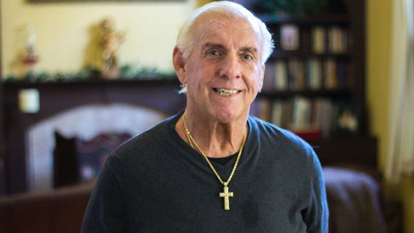 Ric Flair, shown at his Lawrenceville home in October, was given a less than 1 in 5 chance to live after he fell ill in August. He says his medical bills for the recent emergency ran above $1 million, and that his recovery included learning to walk again. CONTRIBUTED BY AVERY NEWMARK