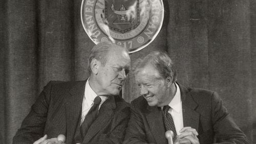 Former U.S. Presidents, Gerald Ford and Jimmy Carter, share a private moment in 1984. On Monday night, Carter won the 2017 Gerald R. Ford Medal for Distinguished Public Service (AP Photo/Detroit Free Press, Hugh Grannum) . On Monday night