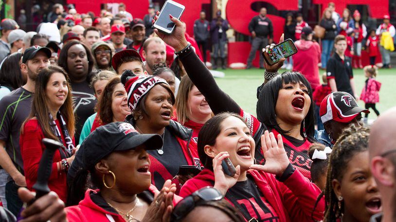 Crowds cheer for the Atlanta Falcons at this Jan. 21 Atlantic Station rally. The Falcons will meet the New England Patriots in Super Bowl LI on Feb. 5. STEVE SCHAEFER / SPECIAL TO THE AJC