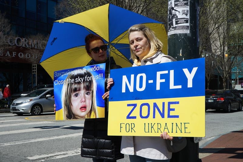 Protesters gather to raise awareness about the plight of children in the war in Ukraine and to call for the establishment of a no-fly zone over the country at a rally held in downtown Atlanta on Saturday, March 19, 2022.