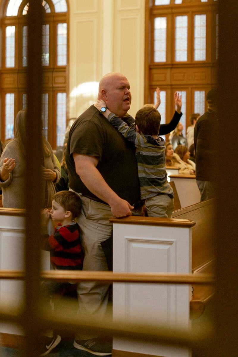 Attendees during worship inside Hughes Chapel on the campus of Asbury University in Wilmore, Ky., on Feb. 18, 2023. The revival was driven by Generation Z but attracted a range of people, including families. (Jesse Barber/The New York Times)